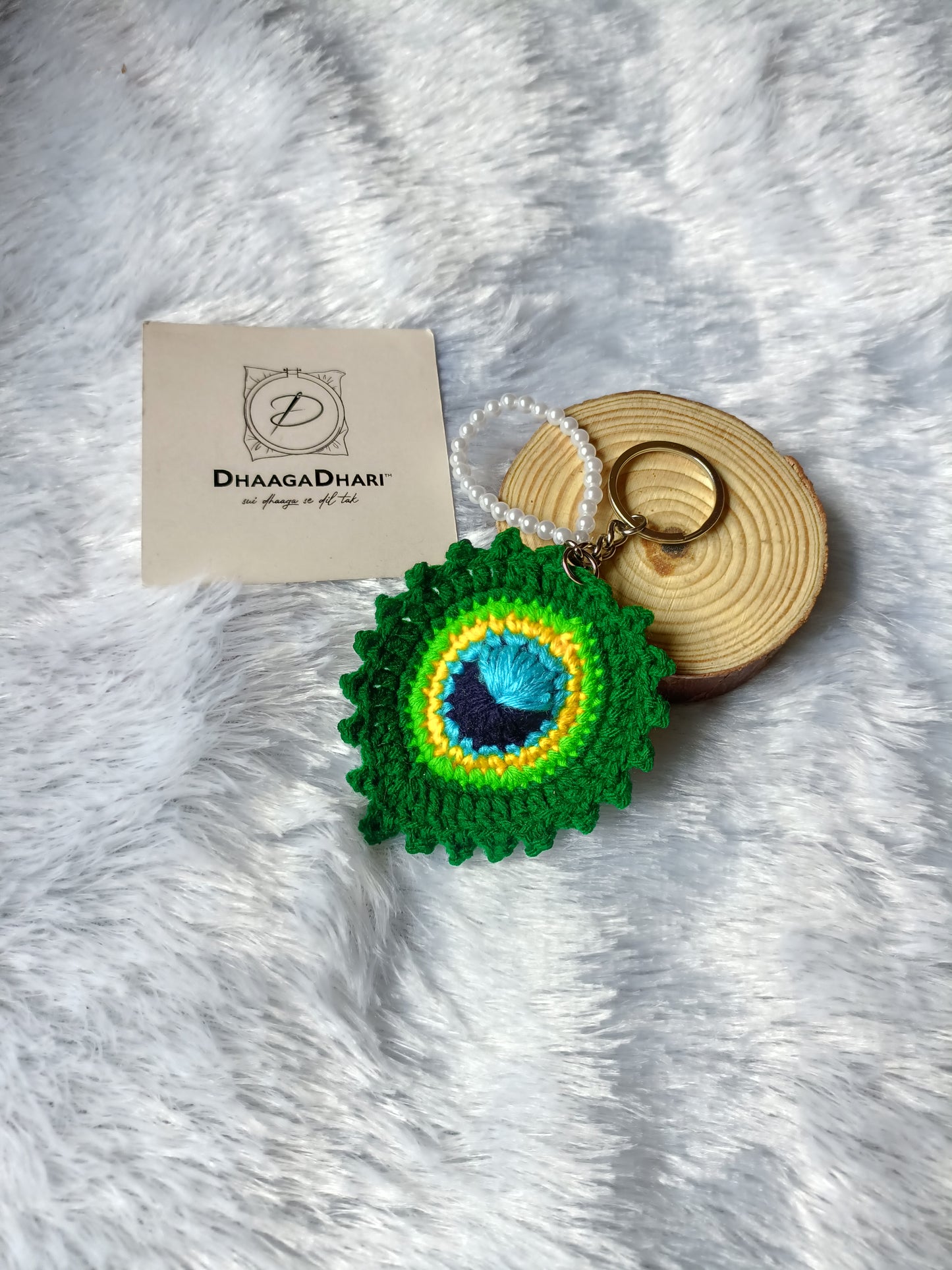 Handcrafted Crochet Peacock Feather Keychain with Pearl Accents