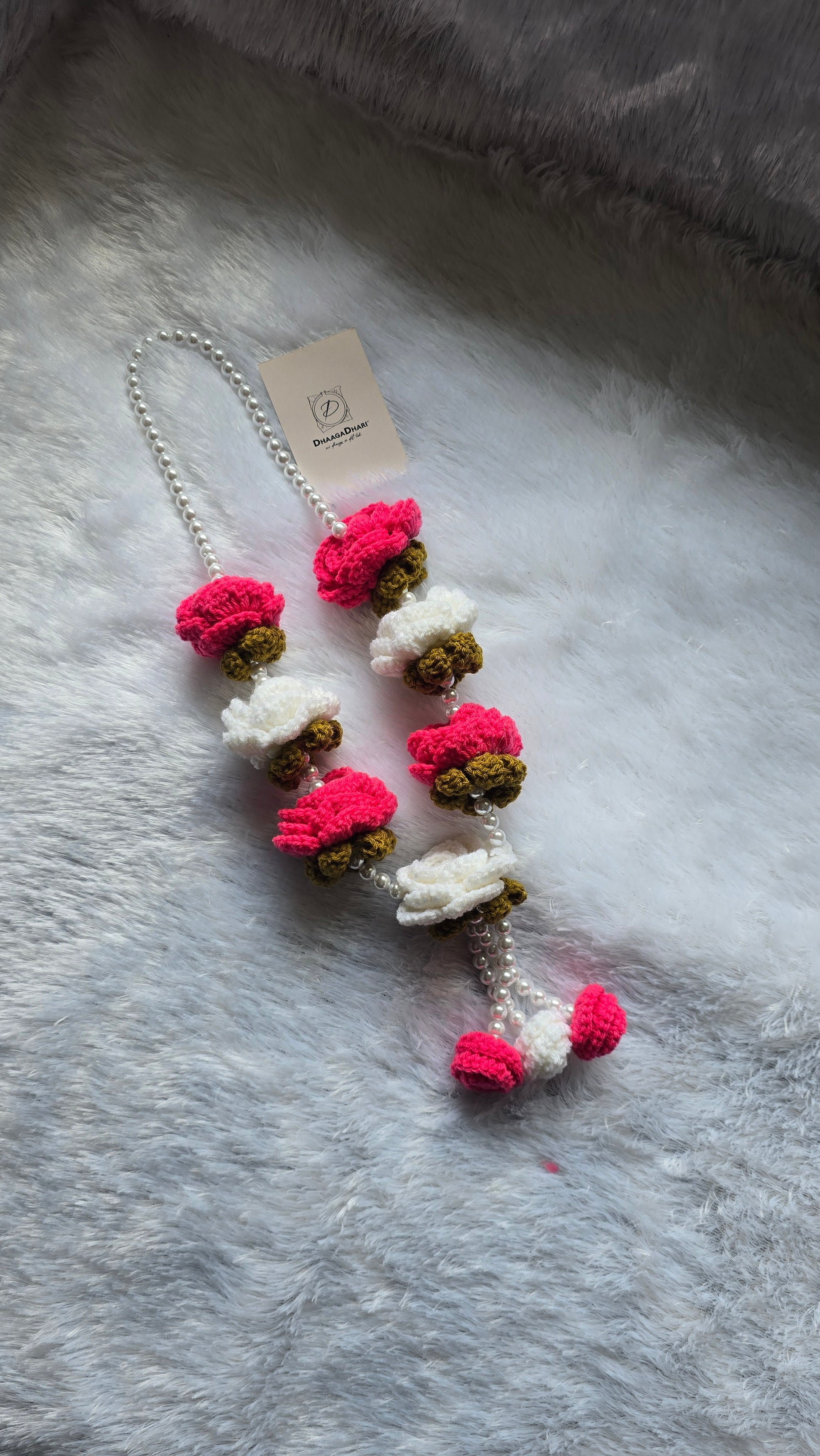 A Crochet Garland with white pearl